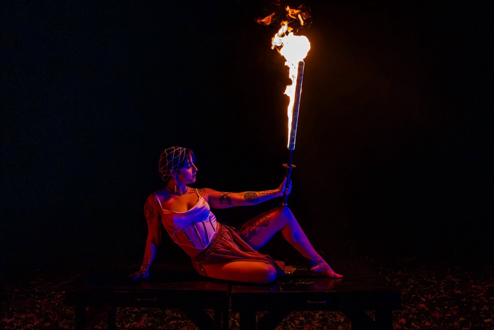 Fire-fan performance glowing against the dark